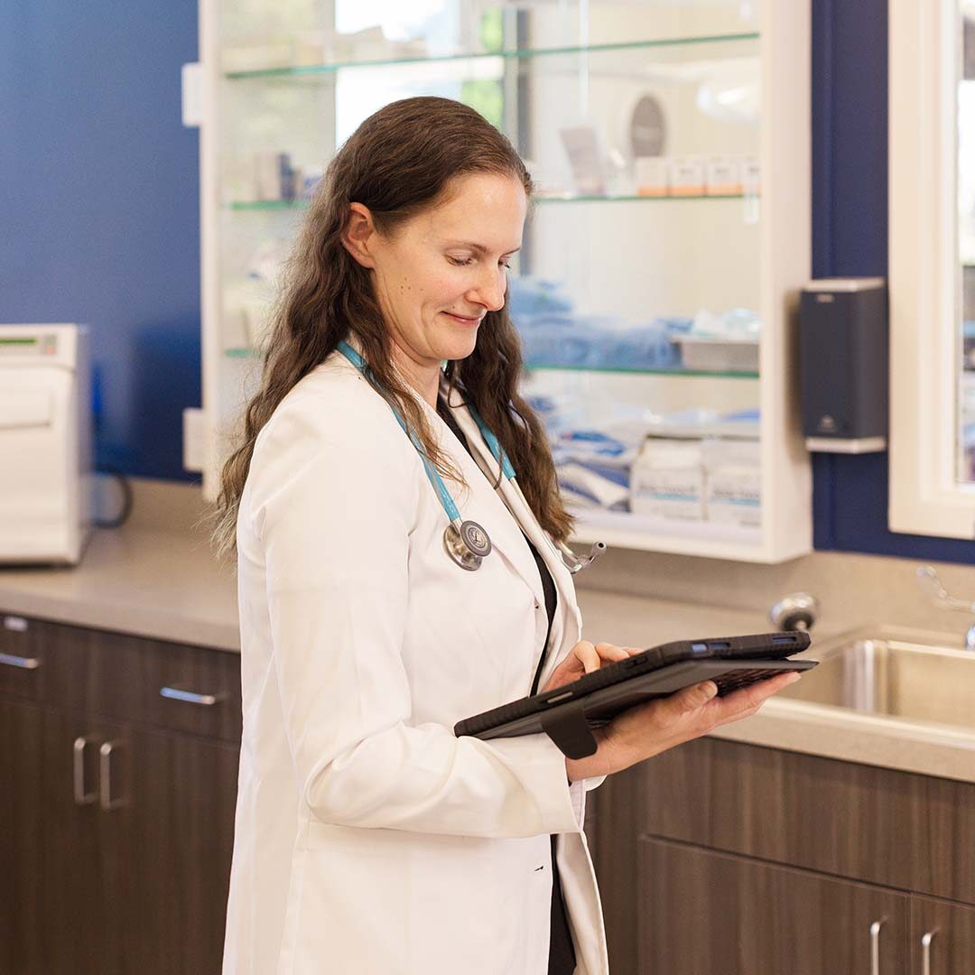 Dr. Biele holds a clipboard